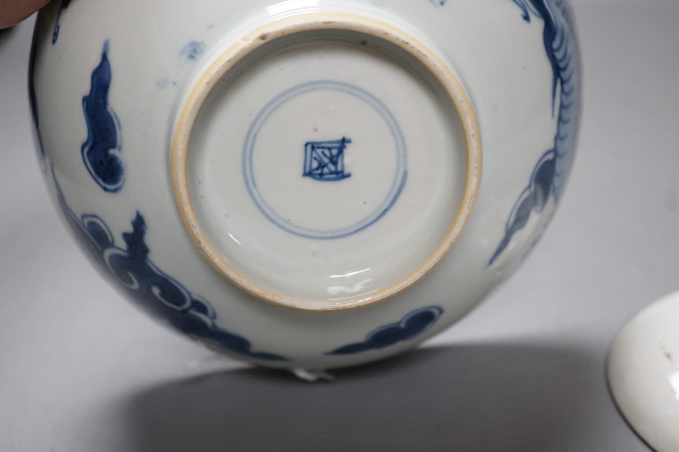 A 19th century Chinese ‘dragon’ bowl, together with a smaller ‘dragon’ dish. Largest 18.5cm diameter